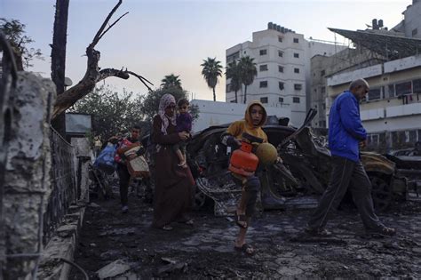 Israel will let Egypt deliver some aid to Gaza, as doctors struggle to treat hospital blast victims